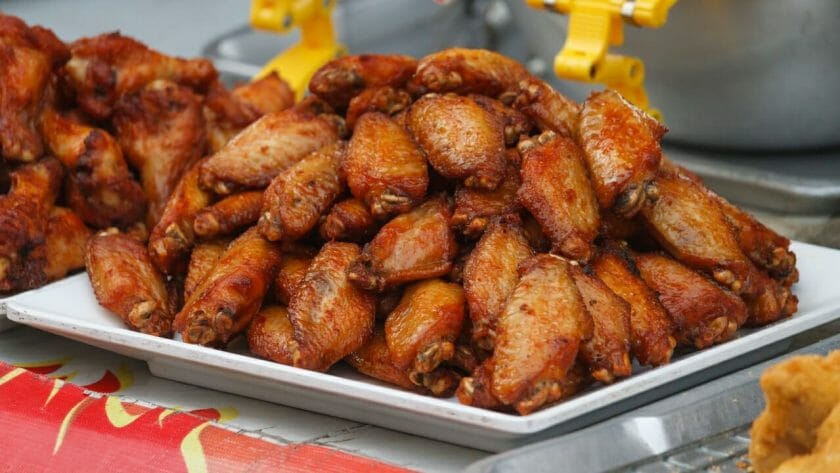 person eating chicken wings ss567612190